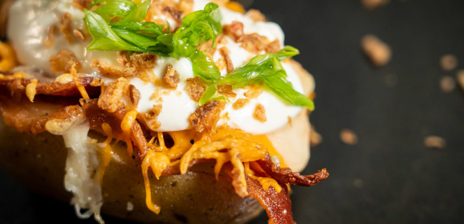 baked potato with bacon and cheese