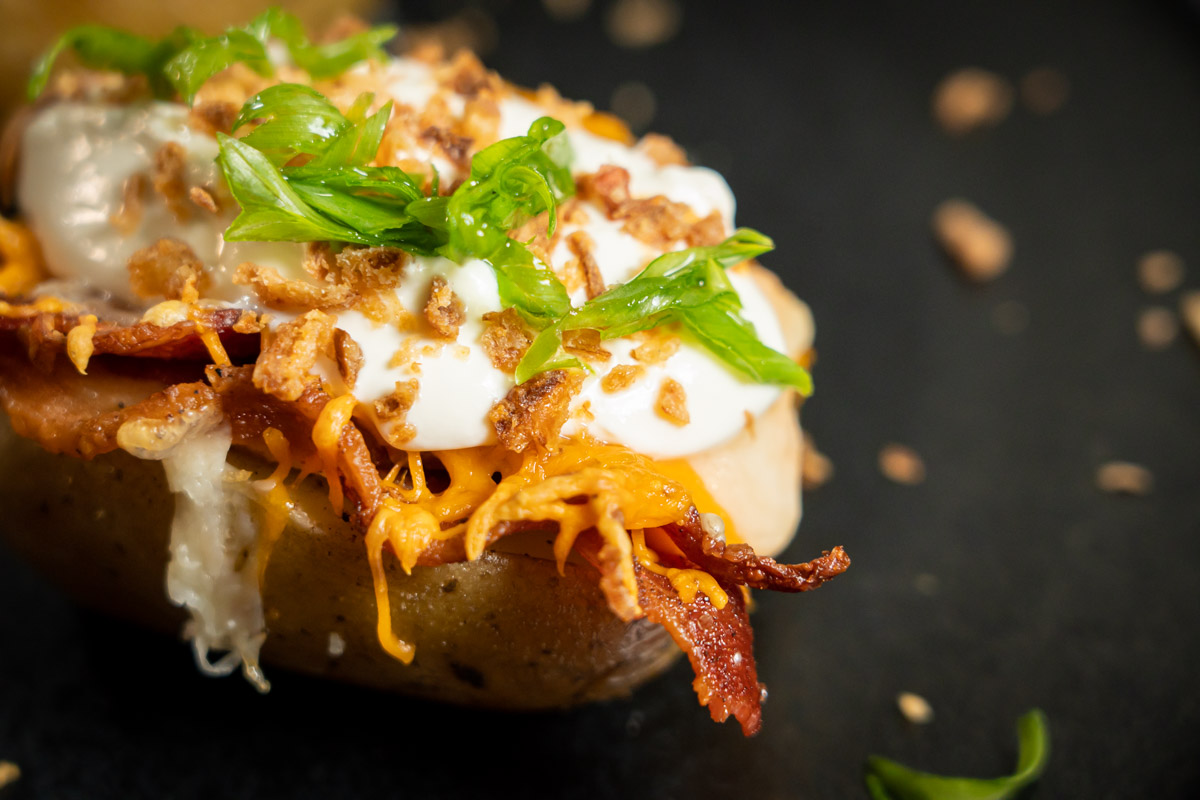 baked potato with bacon and cheese