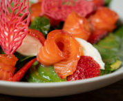homemade salad with salmon gravlax and strawberrie